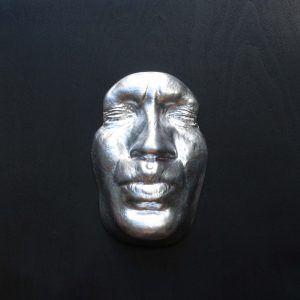 Silver effect Kiss on black background, wooden base 30x30cms
