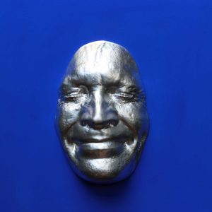 Silver effect Smile on blue submarine background, wooden base 30x30cms