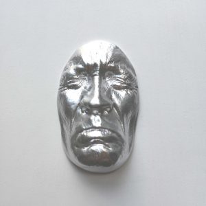 Silver effect Sadness on white background, wooden base 30x30cms