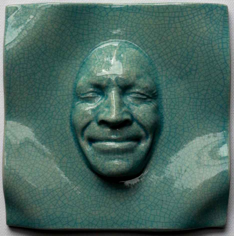Smile Buckled Tile 14x14cms – Crackled Greenish Earthenware 